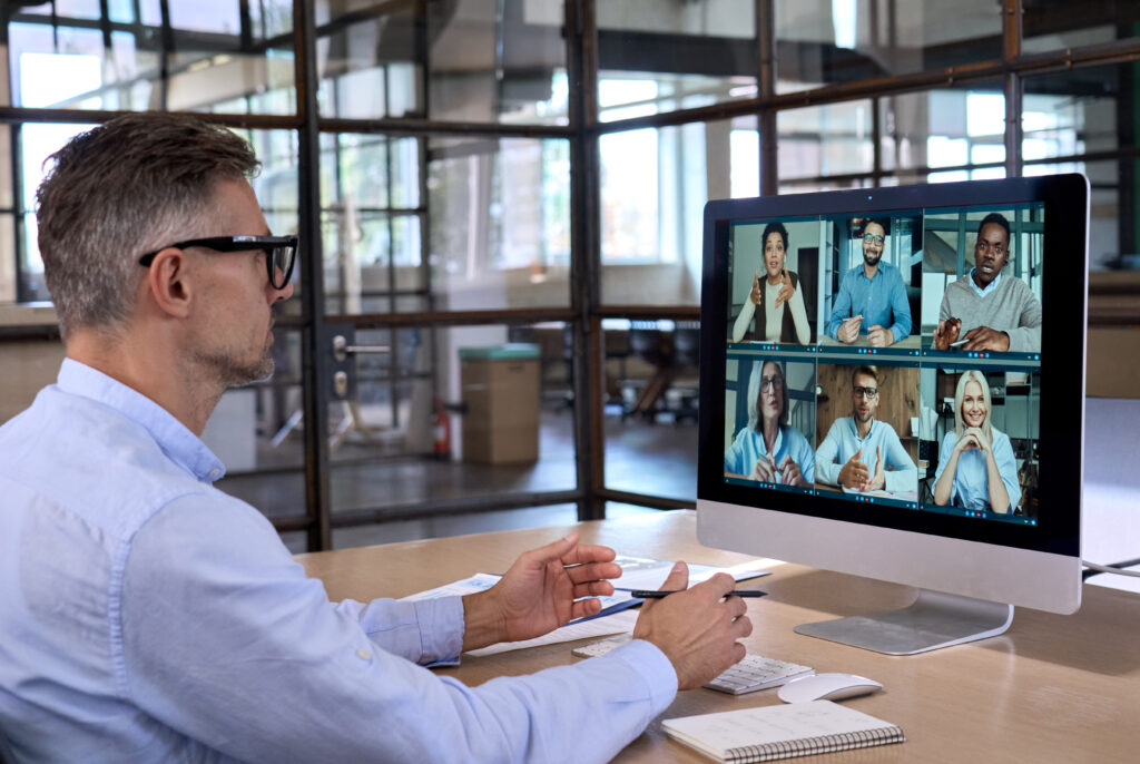 Business professional attending a virtual team meeting on video call